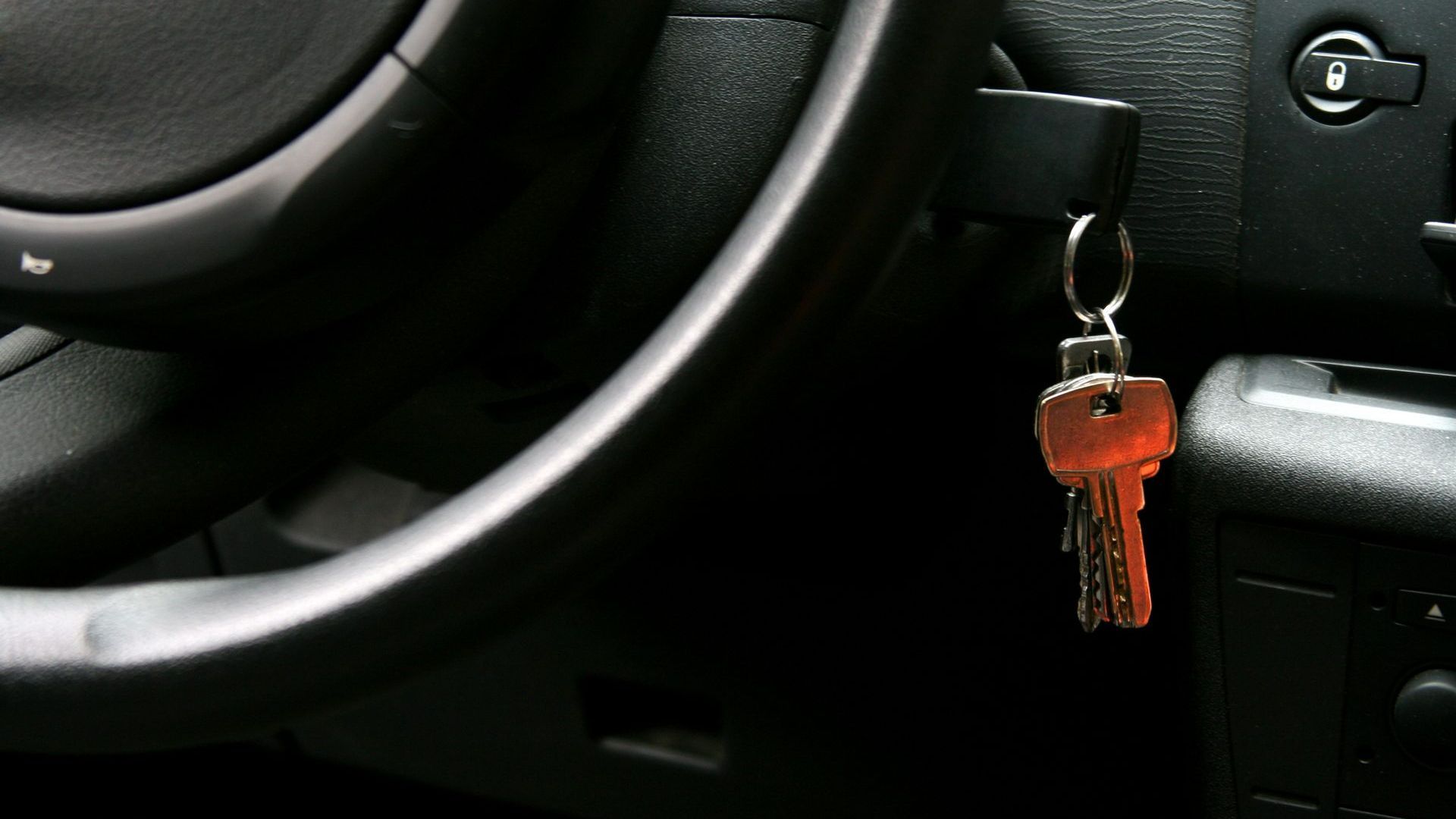 A Car Key Is Hanging from The Steering Wheel | Westminster, CO | M.L. Locksmith