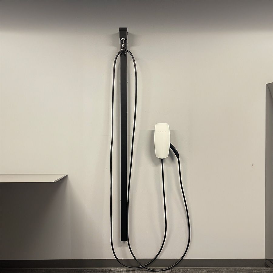 The Wattz Up wall retraction unit is installed in a showroom to showcase the cable management feature.