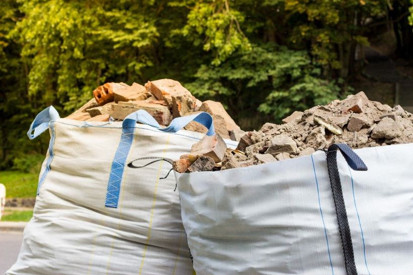 Debris piled in a garbage bag