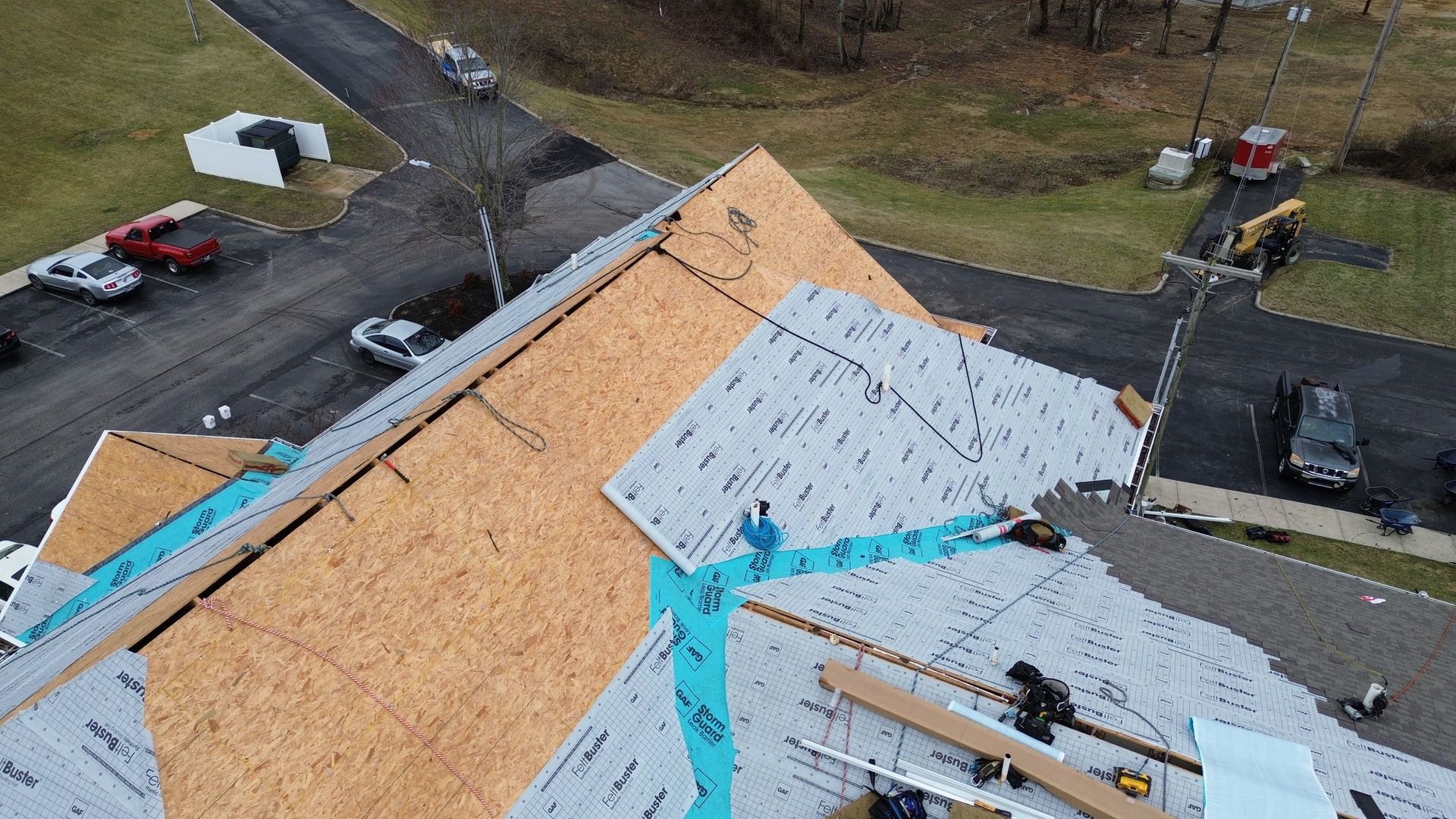 An aerial view of a roof being installed on a house.