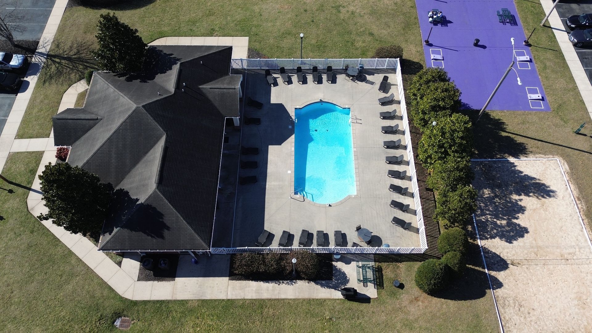 An aerial view of a swimming pool in a park
