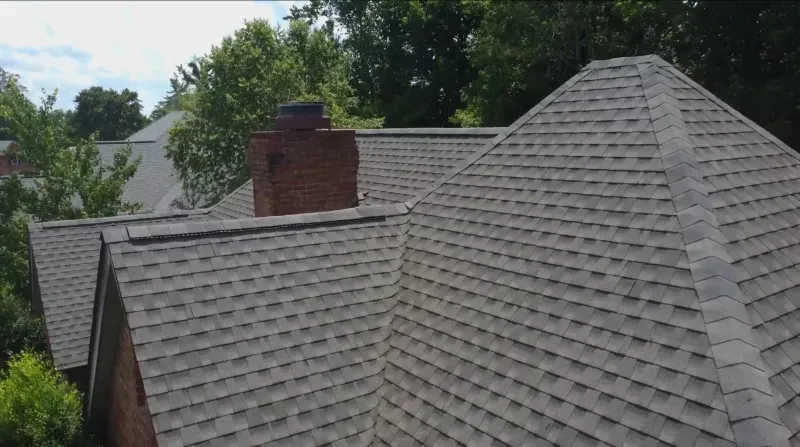 An aerial view of a roof of a house with a chimney.