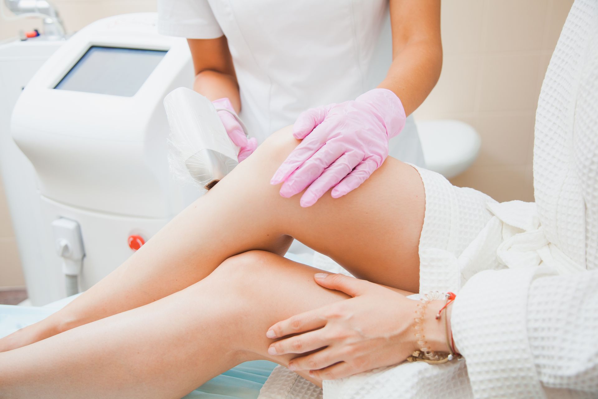 Person receiving laser hair removal on leg.