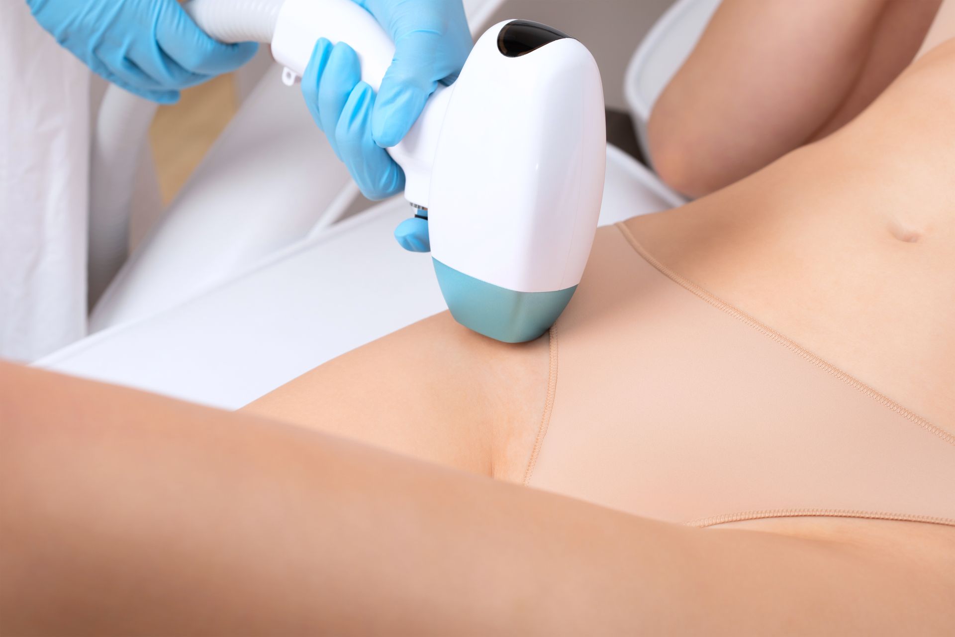 Laser hair removal on a person's bikini area. 