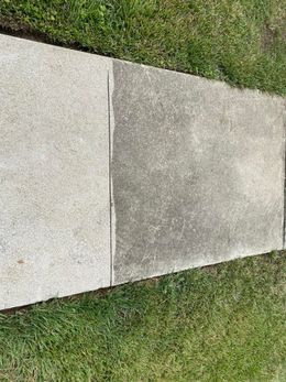 A before and after picture of a concrete sidewalk.