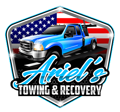 Ariel's Towing & Recovery logo: Blue tow truck in front of American flag, over road.