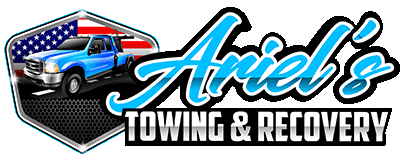 Logo for Ariel's Towing & Recovery: Blue tow truck in a hexagon with American flag.