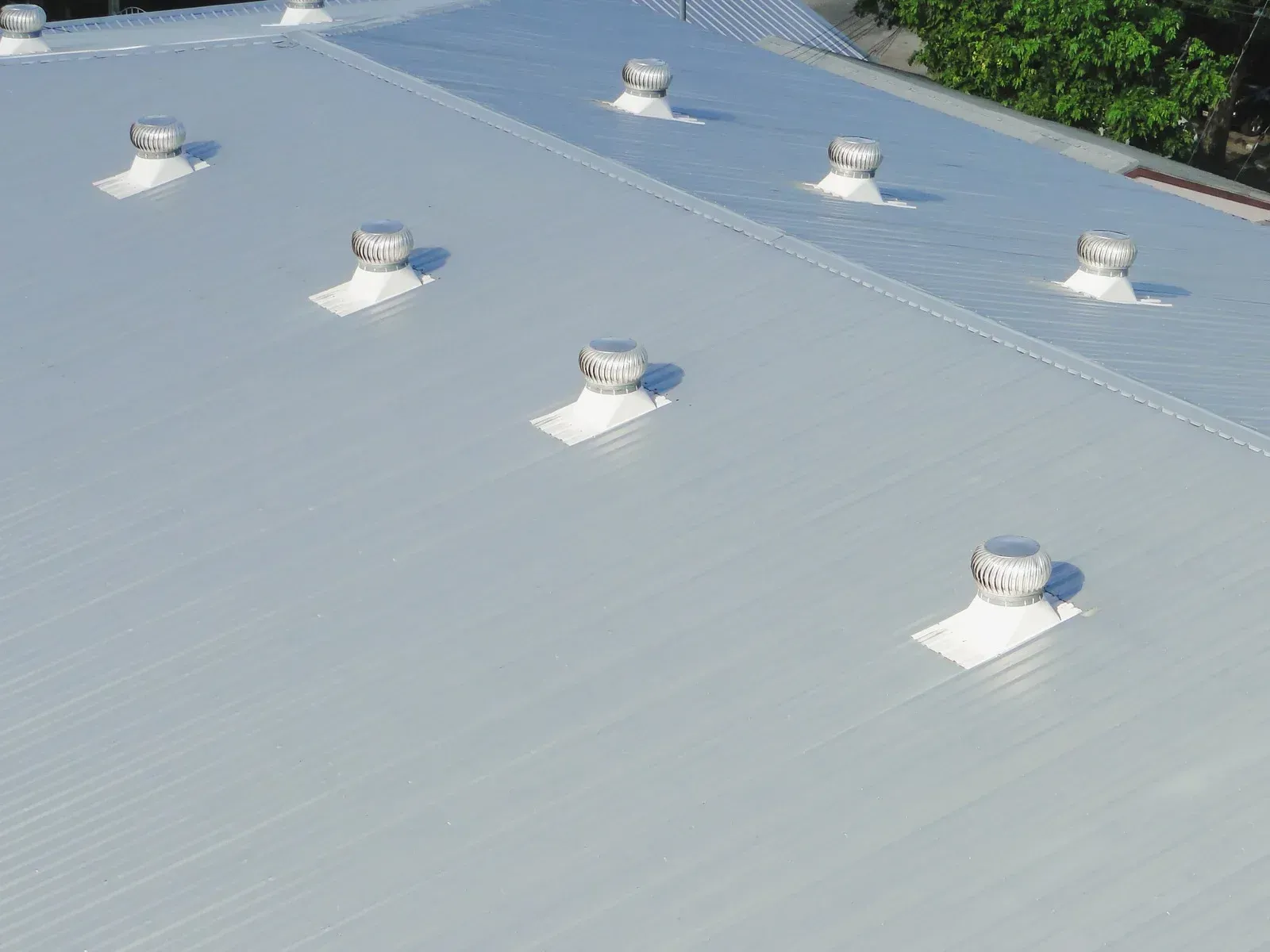 A roof with a lot of vents on it.