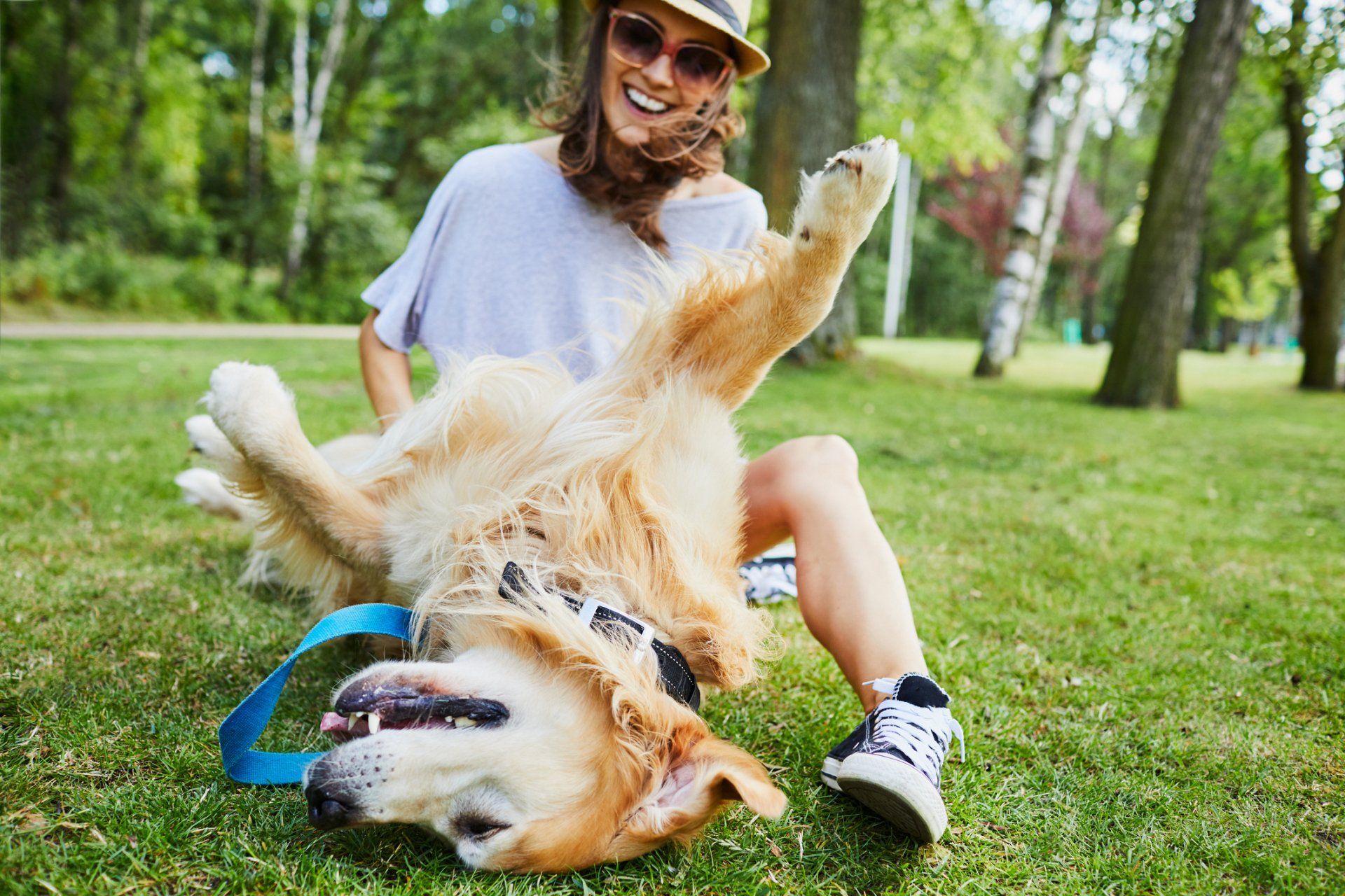 woman playing with dog