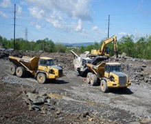 Truck Working At Industrial Site — Construction And Excavation Services in Harrisburg, PA