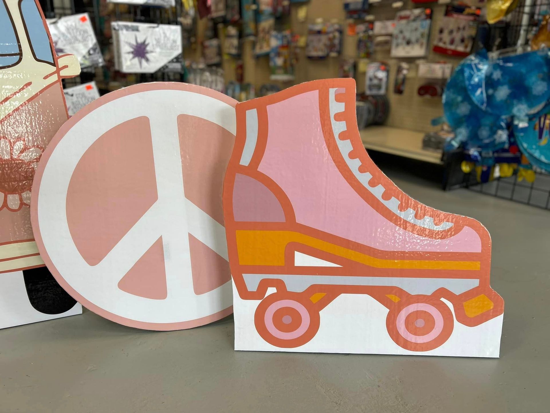 A peace sign and a roller skate are sitting on a table.