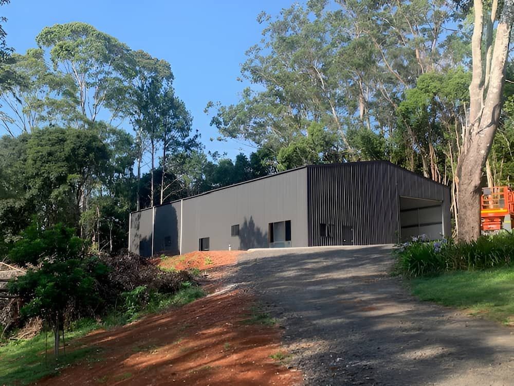 Gray and Black Metal Building on a Gravel Driveway — Northern Rivers Sheds in South Lismore, NSW
