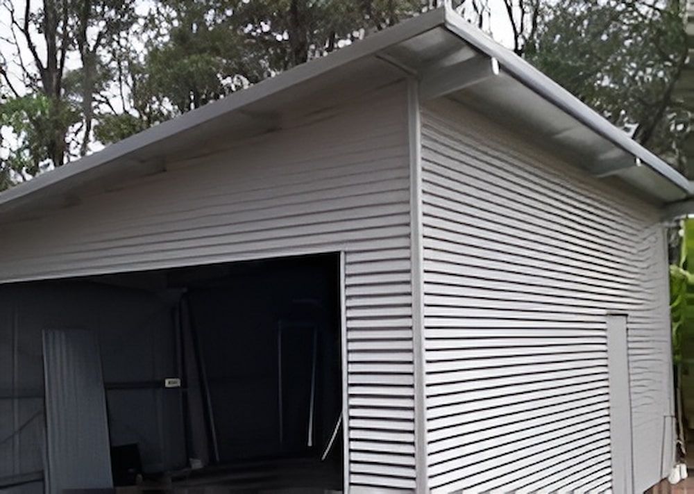 Garage With Horizontal Siding, Open Bay, and Gray Metal Roof — Northern Rivers Sheds in South Lismore, NSW