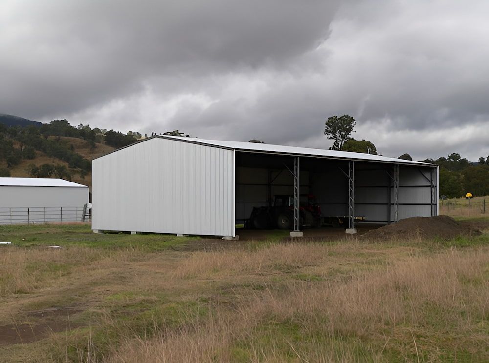 White Metal Farm Shed With Open Side, Grey Cloudy Sky, and a Field — Northern Rivers Sheds in South Lismore, NSW