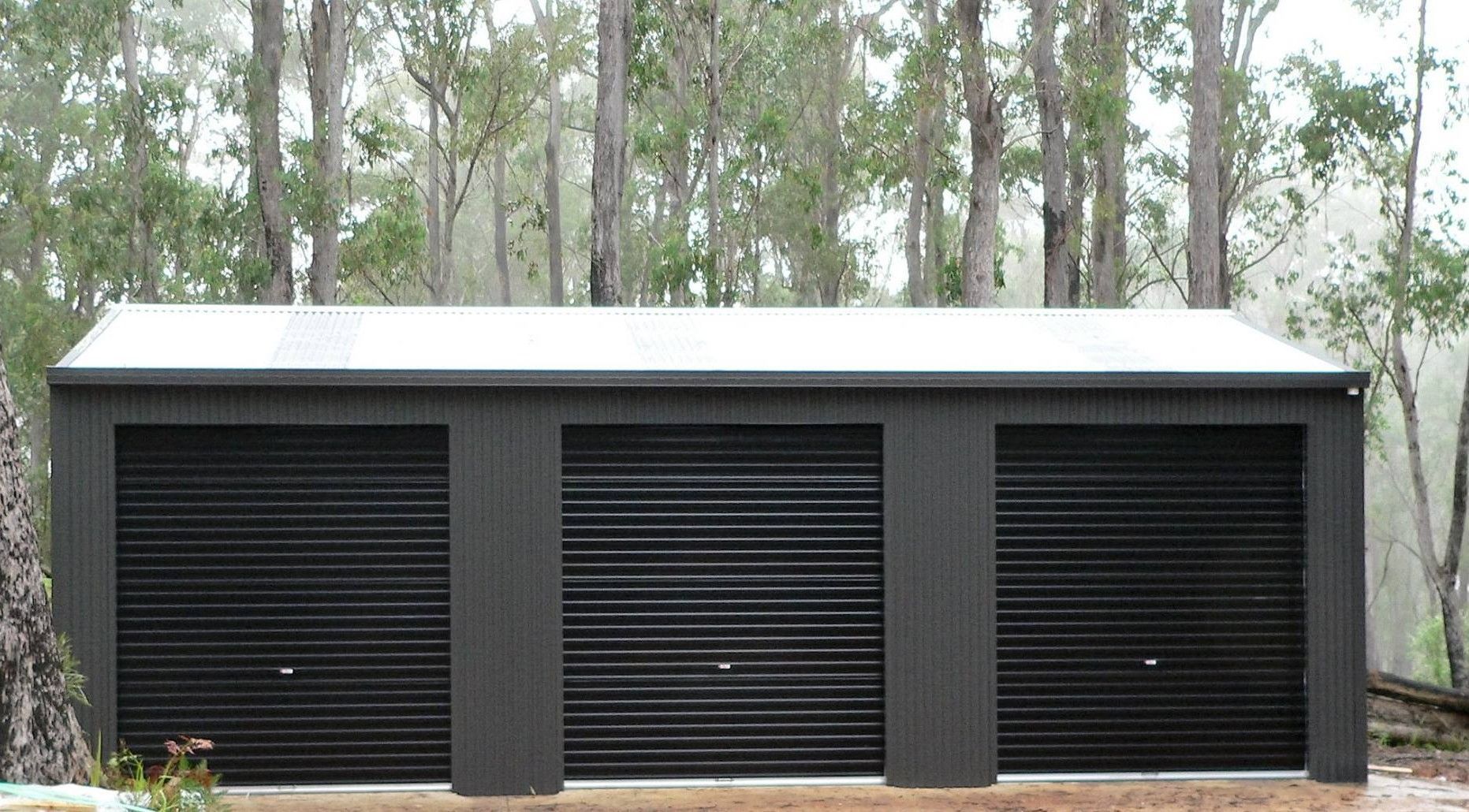 Backyard With House, Shed, Wooden Fence, and Green Grass — Northern Rivers Sheds in South Lismore, NSW