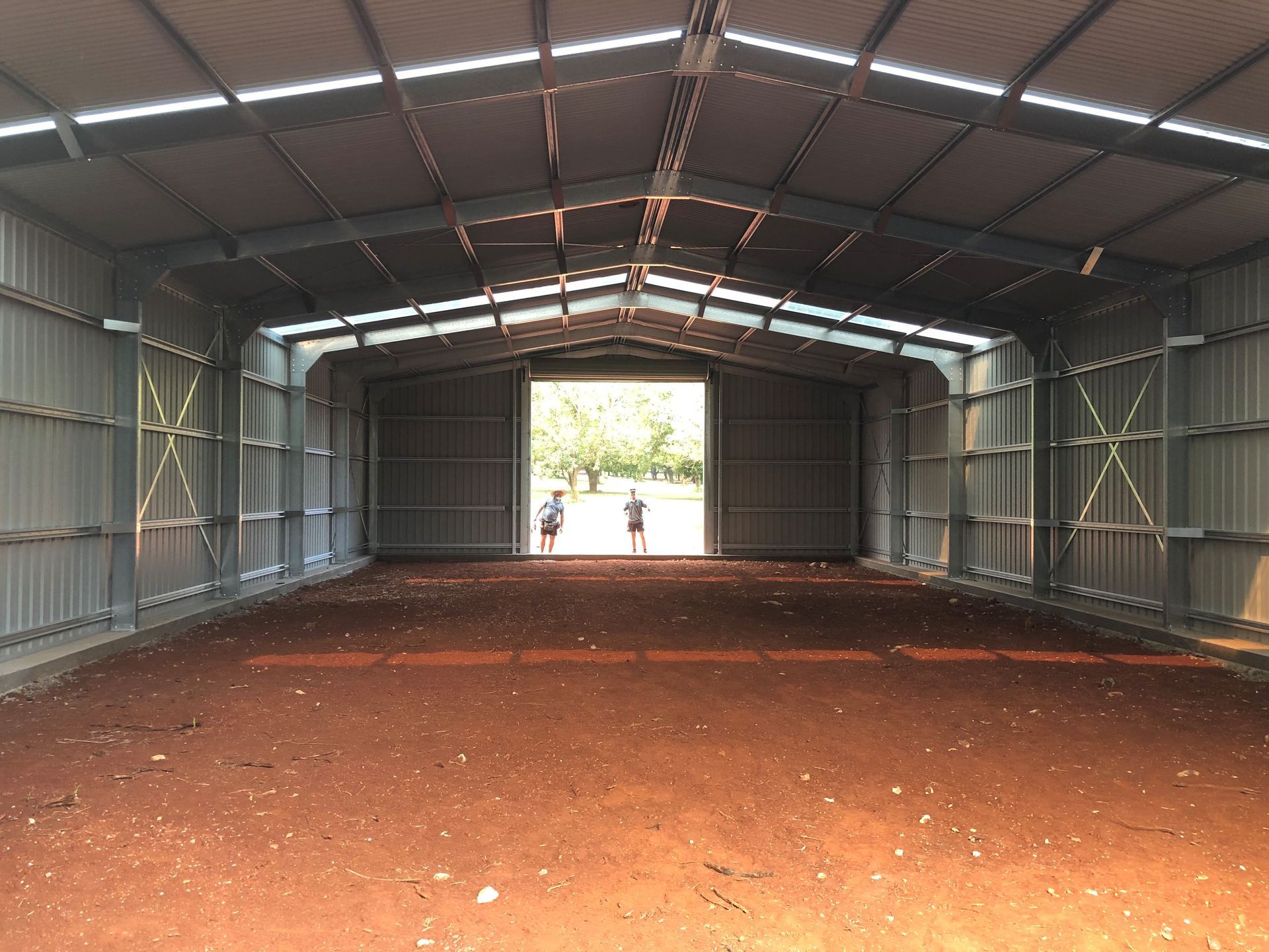 Metal Shed With Open Front Door on Dirt Ground — Northern Rivers Sheds in South Lismore, NSW