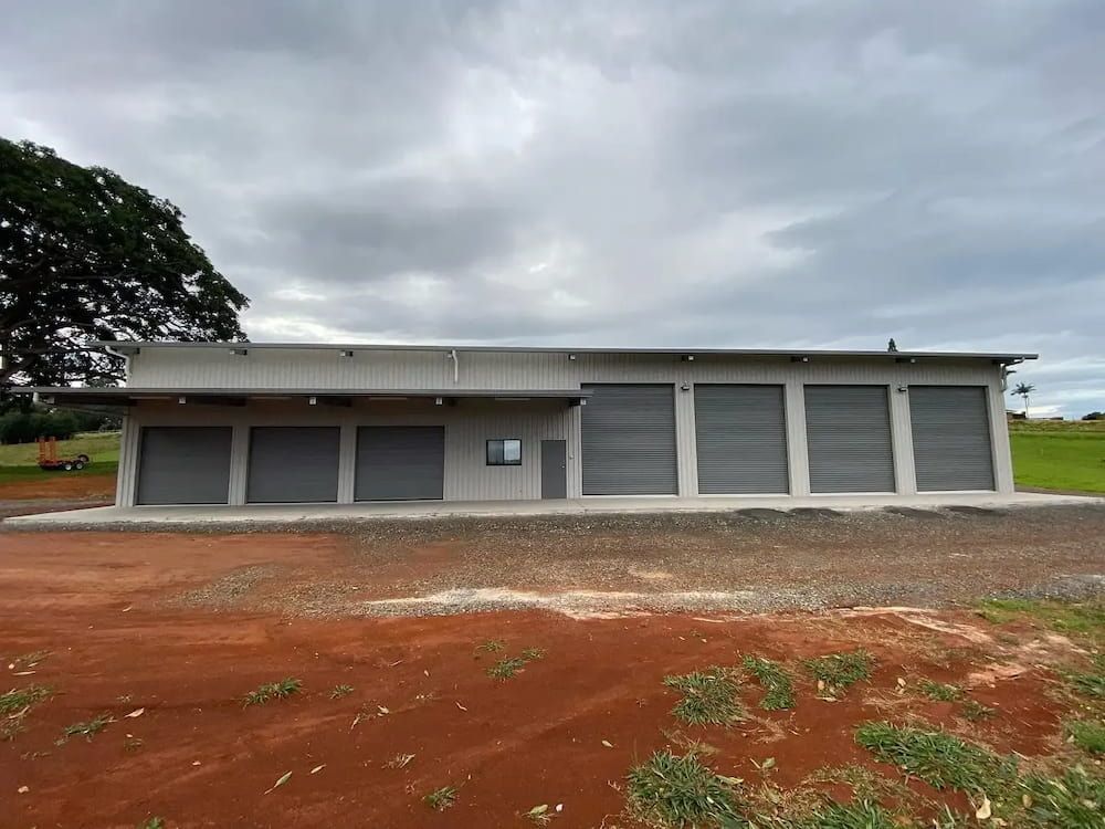 A Gray Building With Multiple Garage Doors — Northern Rivers Sheds in South Lismore, NSW