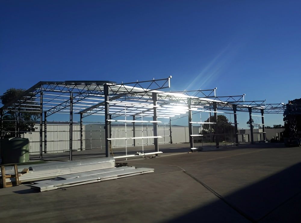 Steel Structure Under Construction, Outdoor Industrial Setting, Bright Sunlight — Northern Rivers Sheds in South Lismore, NSW