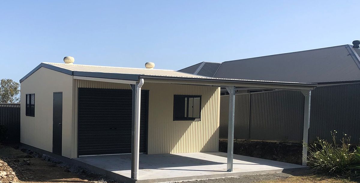 Red Wooden Garden Shed With a Door and Window, in a Green Yard — Northern Rivers Sheds in South Lismore, NSW