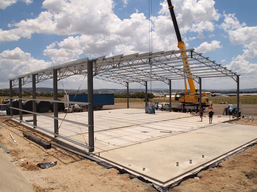 Steel Frame of a Building Under Construction, With Crane — Northern Rivers Sheds in South Lismore, NSW