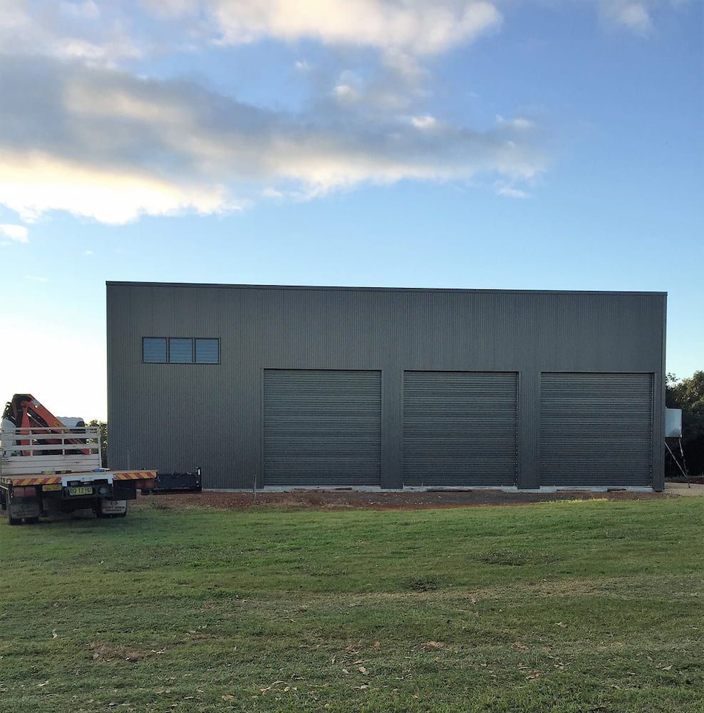 Gray Building With Three Garage Doors — Northern Rivers Sheds in South Lismore, NSW
