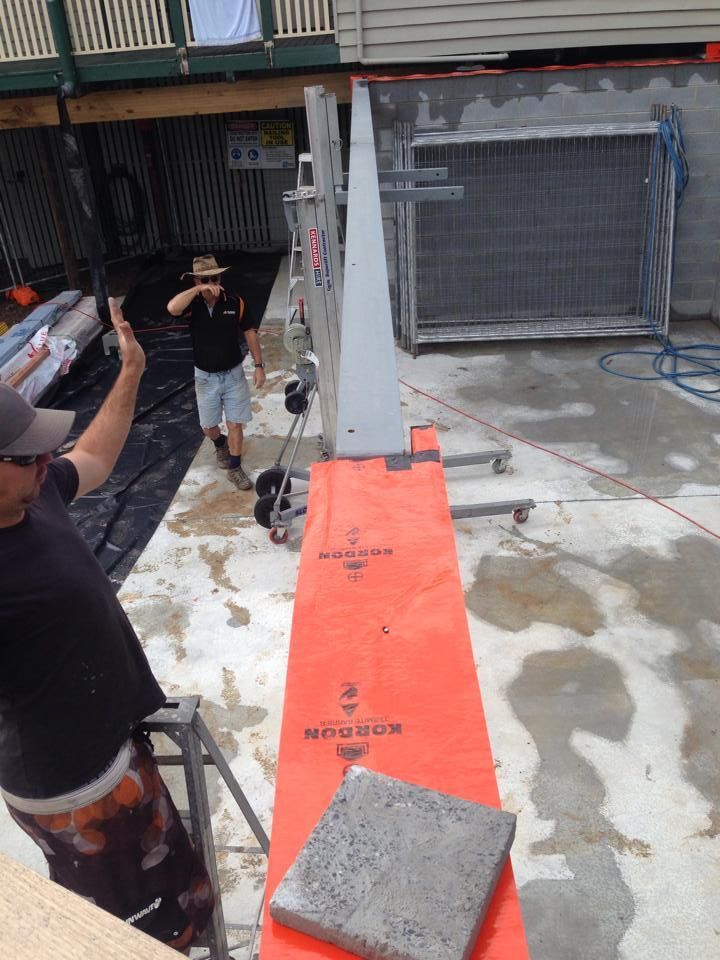 Two Men Operate a Concrete Saw Outside — All Pest QLD In Sippy Downs, QLD