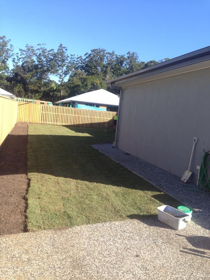 Backyard With Newly Laid Sod Gravel Path Wooden Fence and House Exterior — All Pest QLD In Buderim, QLD