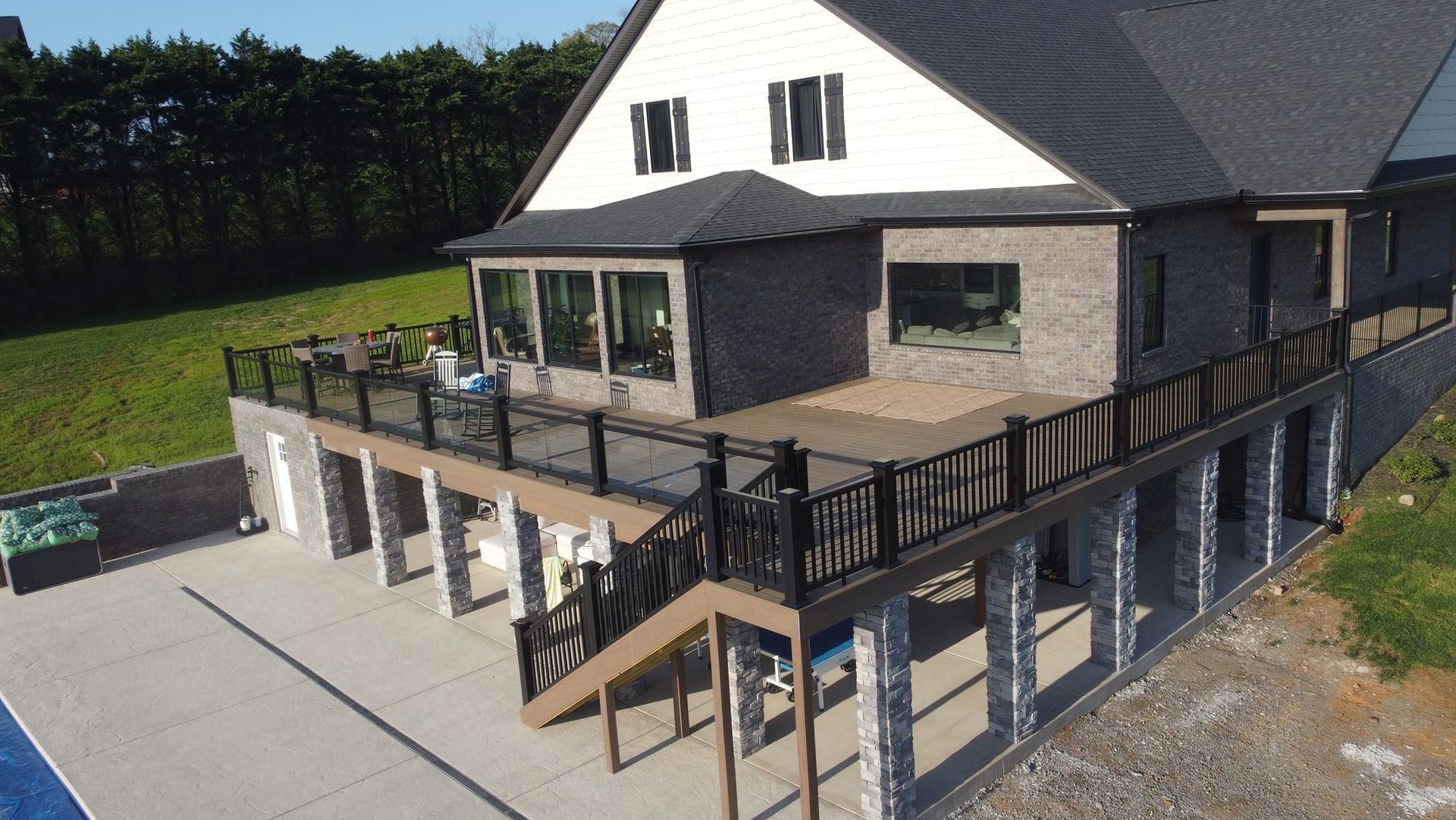 An aerial view of a house with a large deck.