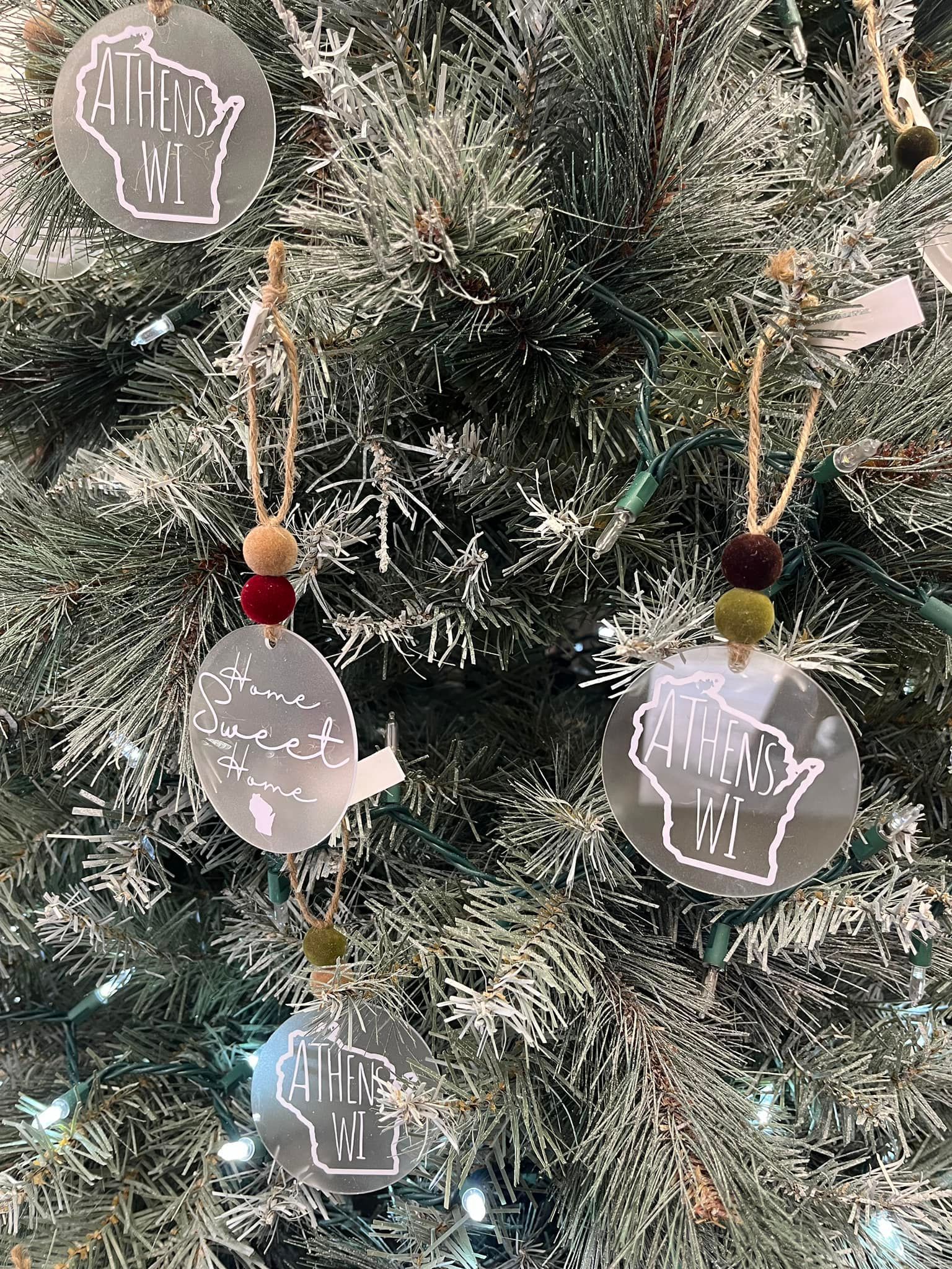 A christmas tree with a bunch of ornaments hanging from it.