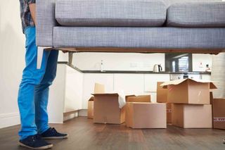 Carrying a sofa — Moving Services in West Milford, NJ