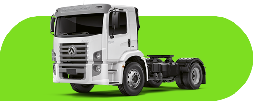 Um caminhão branco está estacionado em um fundo verde.