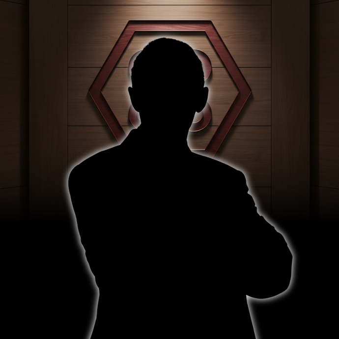 A smiling person in a blue blazer and white blouse stands before a dark wall with a hexagonal emblem.