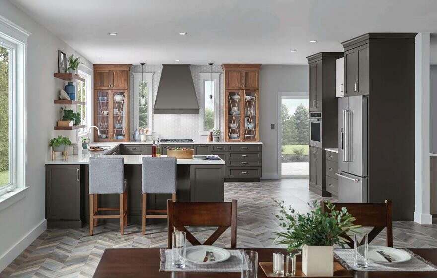 A kitchen and dining room in a house with a table and chairs.