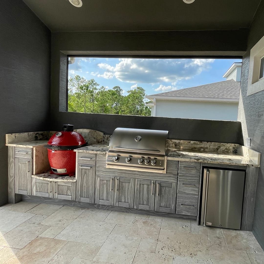 A kitchen with a grill and a large window