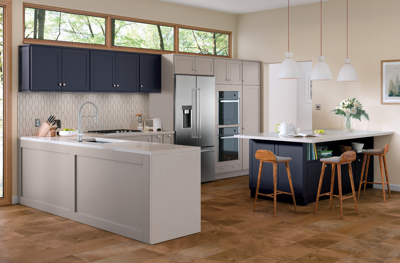 A kitchen with stainless steel appliances and a large island.