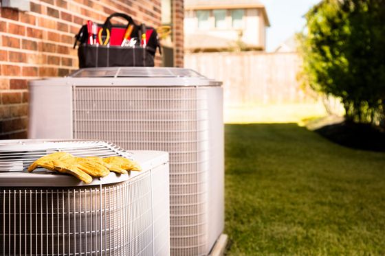 Air Conditioners Are Sitting Next to Each Other — Tucson, AZ — Orozco Brothers Plumbing Heating and Cooling