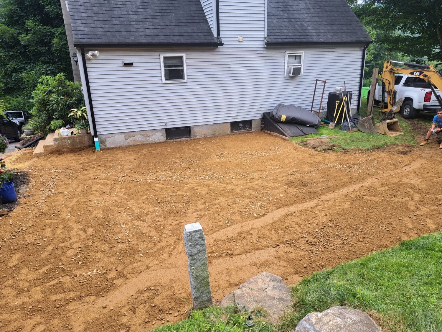 A house with a lot of dirt in front of it.