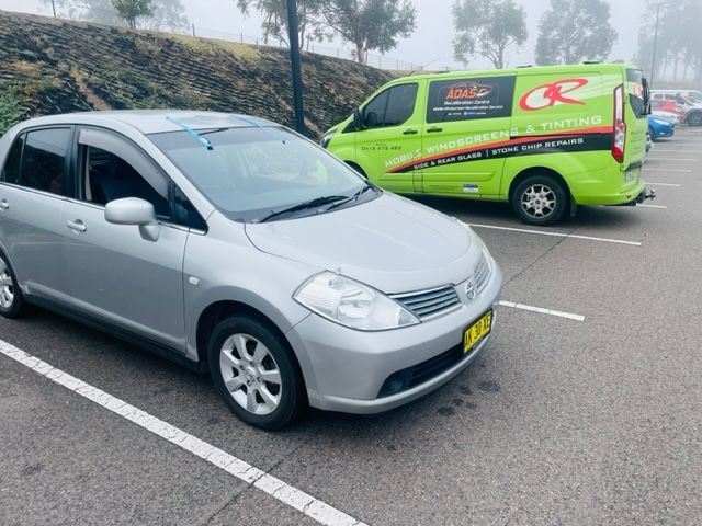 Car in the Parking Lot with Car Window Tint — Windscreen Repair Central Coast