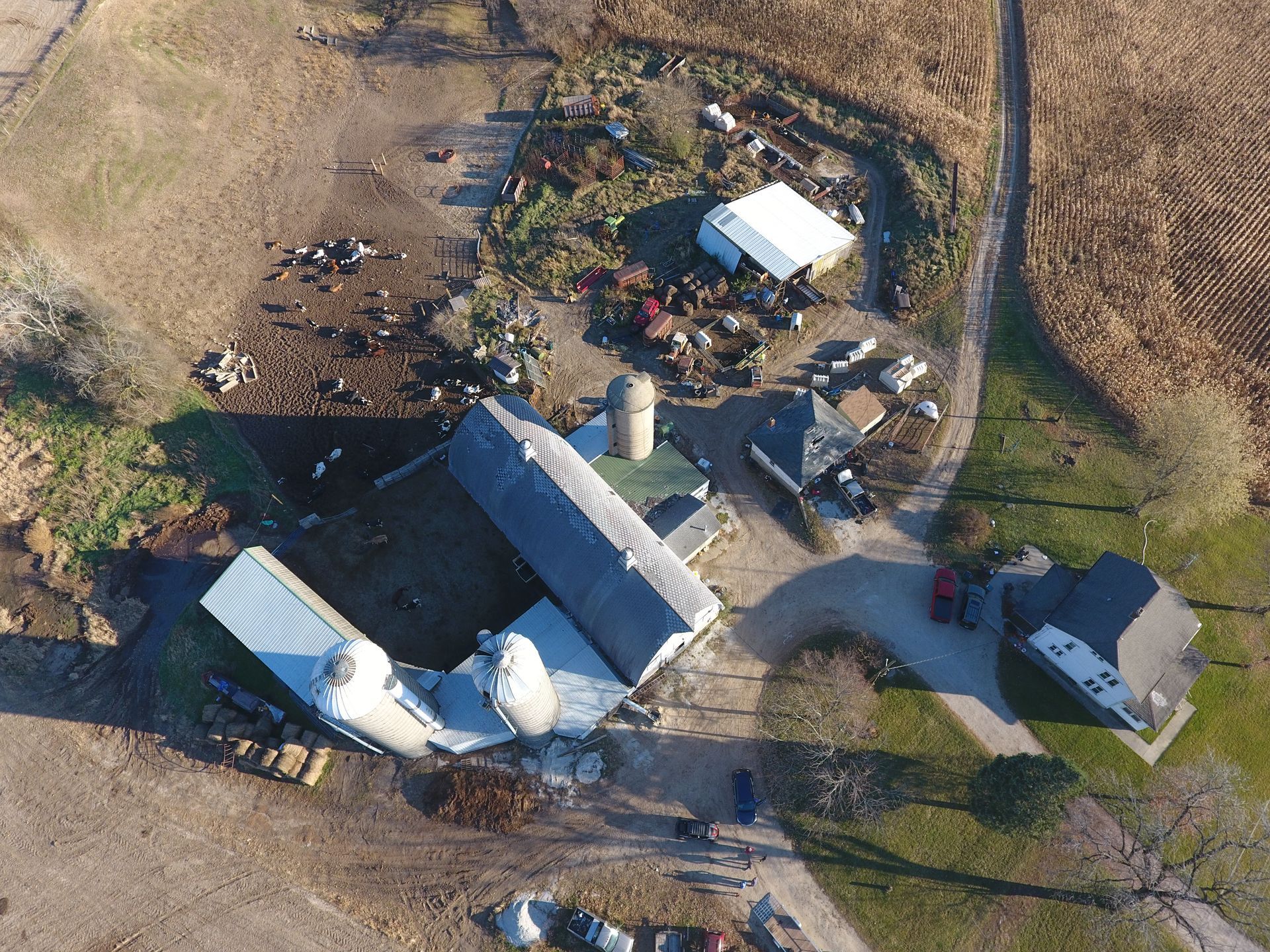 An aerial view of a farm with a lot of buildings