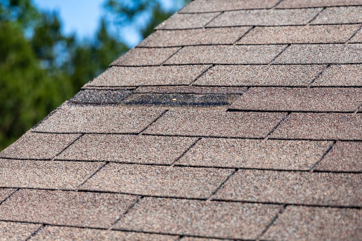 A close up of a roof with shingles on it.
