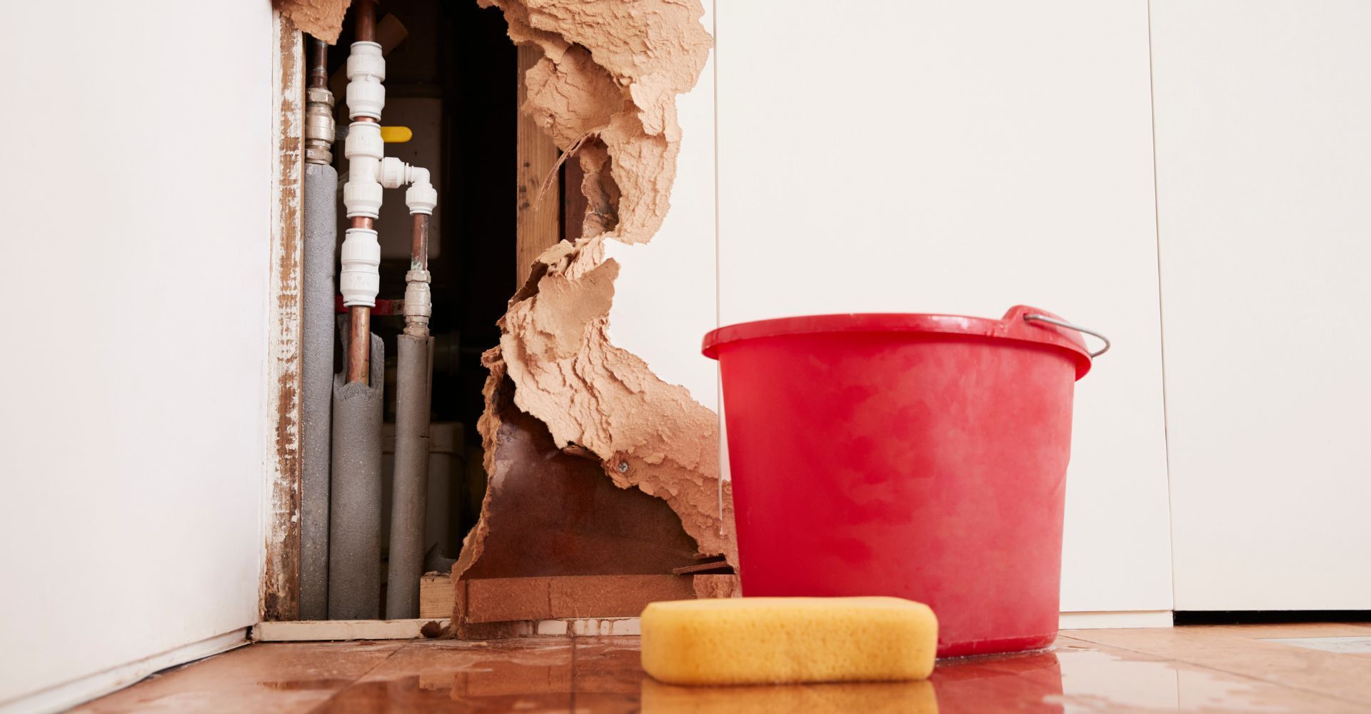 Water Leak in house, pipe, bucket, sponge