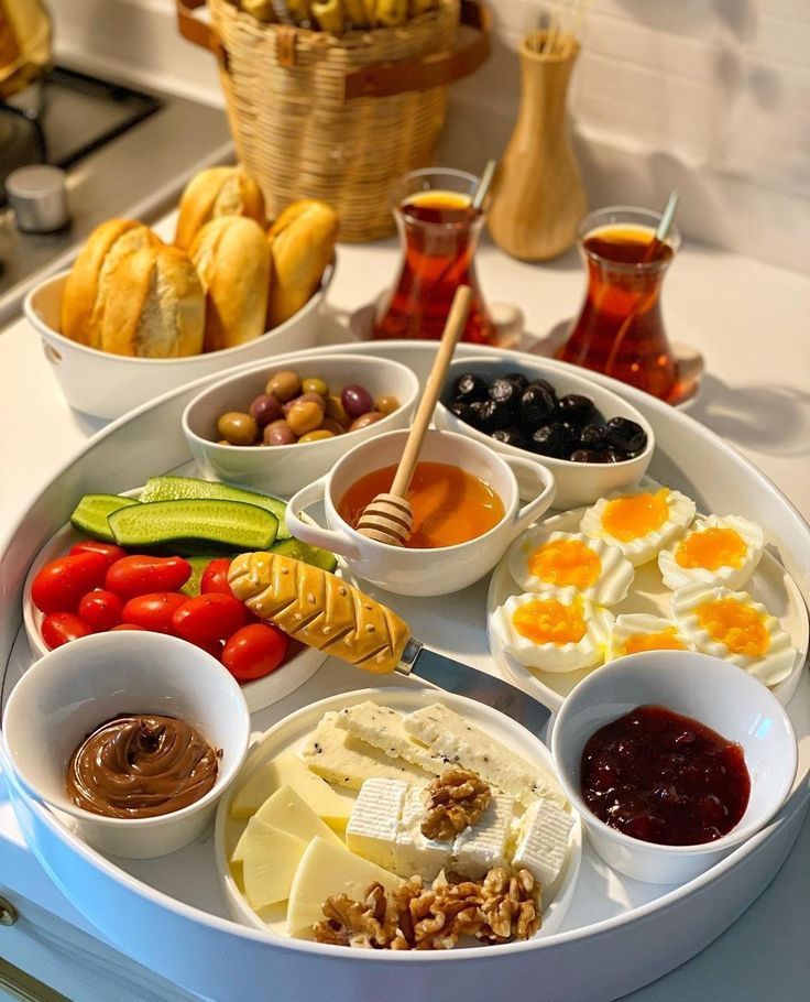 A white tray filled with a variety of food and drinks
