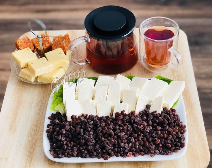 Afghan tasty cheese with black raisins , served with afghan bread and black hot tea at temorian Restaurant Afghan tasty cheese with black raisins , served with afghan bread and black hot tea at temorian Restaurant