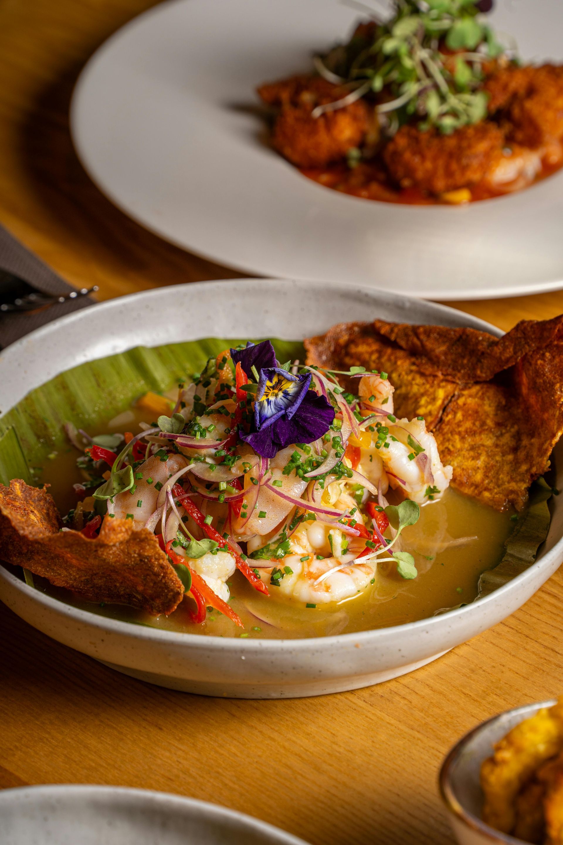 A close up of a bowl of food on a table.