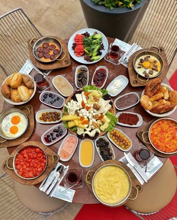 Traditional breakfast table at temorian Reataurant featuuring a rich spread pf pacha, Tokhmi Setaryee ( fried egge ), creamy Qaimag with Panir ( chesses) & Asal(honey) , moraba ( jams) ,Sausages , olives, and hot black tea Traditional breakfast table at temorian Restaurant featuring a rich spread pf pacha, Tokhmi Setaryee ( fried egg ), creamy Qaimag with Panir ( chesses) & Asal(honey) , moraba ( jams) ,Sausages , olives, and hot black tea