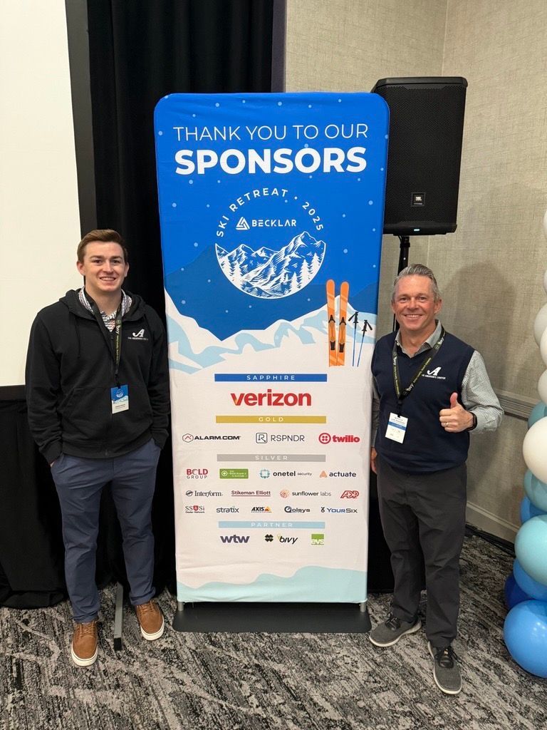 Two people stand on either side of a 