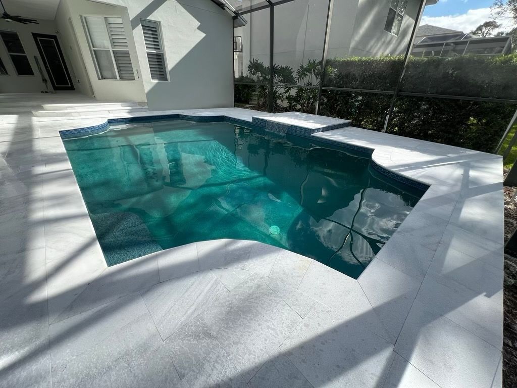 Stone Mart - Akoya French Pattern Stone Mart - Akoya French Pattern  pool deck in Tampa, FL