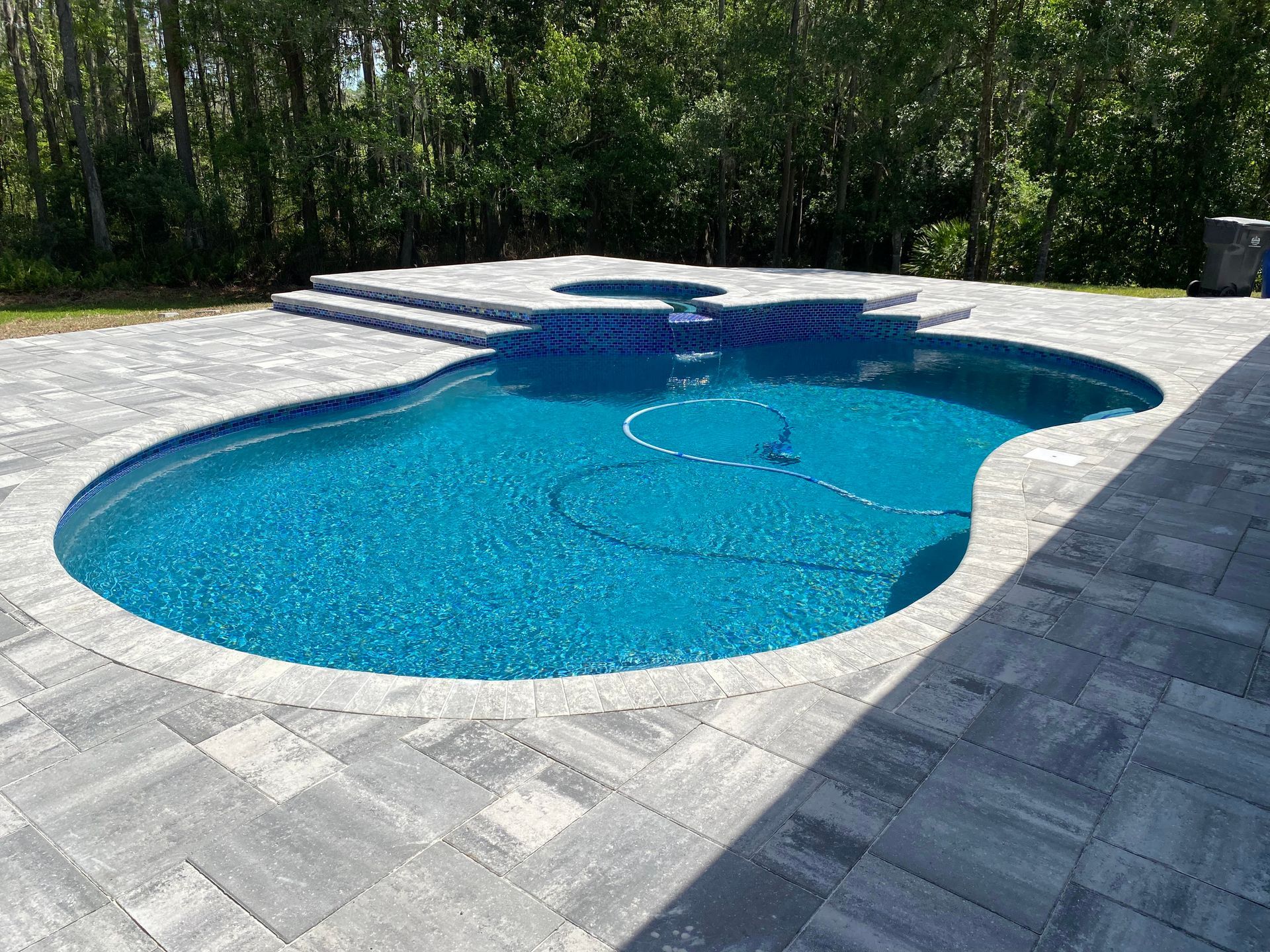 Belgard - Lafitt Grana in Titanium. Brick paver pool deck in tampa, FL