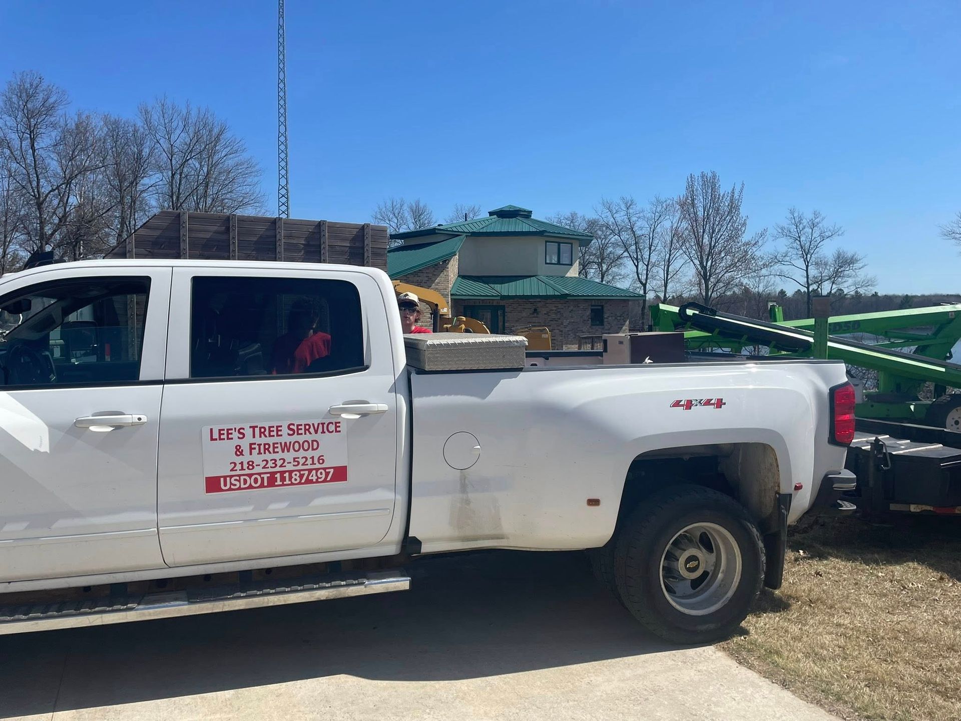 A white truck is parked on the side of the road