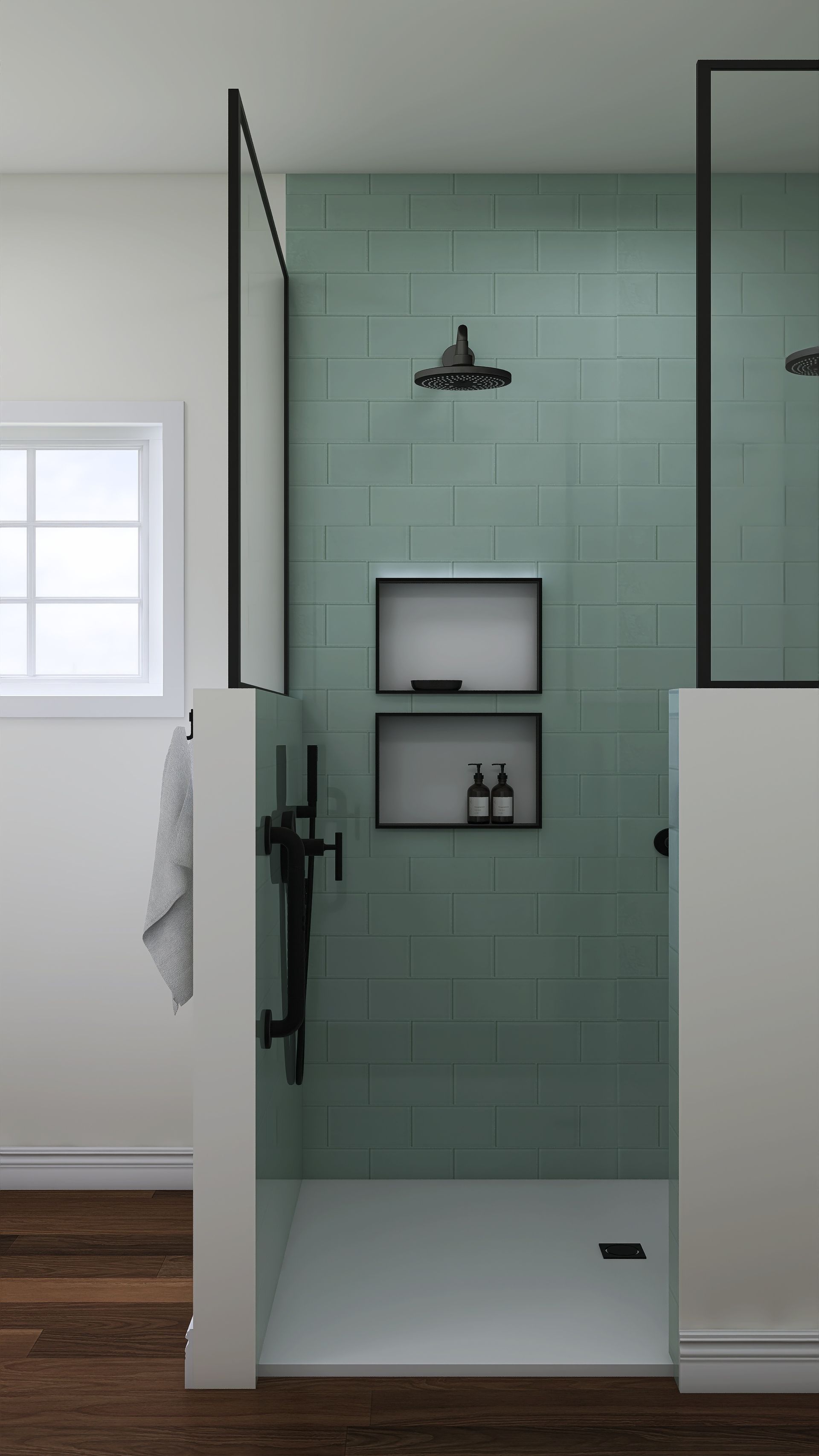 A bathroom with green tiles and a walk in shower.